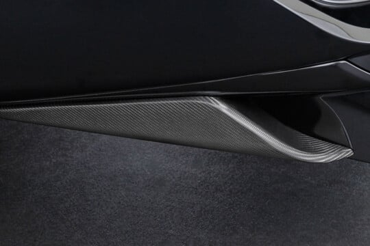 Carbon rear skirt attachment